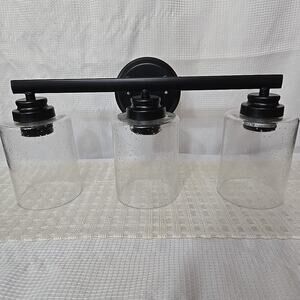 NWB Craftmade Bolden 3 Light Vanity Flat Black Clear Seeded Glass 24x 9 Inch